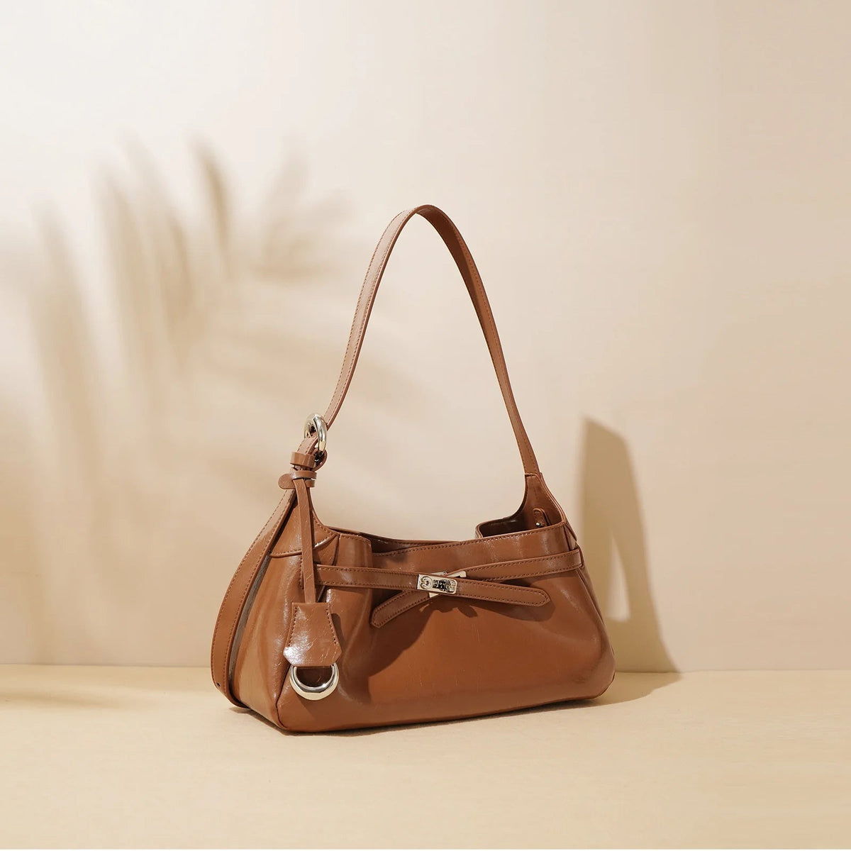 Borsa brillante con cinturini incrociati