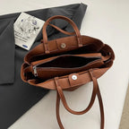 Borsa a doppio manico con cuciture a contrasto